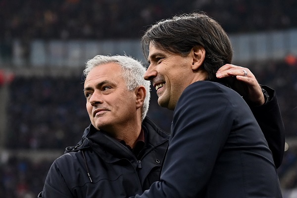 Roma's coach Jose Mourinho from Portugal (L) hugs Inter Milan's coach Simone Inzaghi from Italy ahead of the Italian Serie A football match between Inter Milan and AS Roma at San Siro stadium in Milan on April 23, 2022. (Photo by MARCO BERTORELLO / AFP) (Photo by MARCO BERTORELLO/AFP via Getty Images)